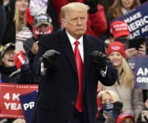 President Donald Trump dances after speaking at a campaign rally at Oakland County International Airport, Friday, Oct. 30, 2020, in Waterford Township, Mich. (AP Photo/Jose Juarez)