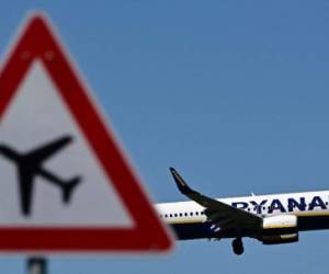 An airplane of Irish airline Ryanair approaches the BER airport near Berlin Schoenefeld on May 31, 2021. - Polish police said on May 31, 2021 they were investigating a fake bomb threat that forced a Ryanair passenger plane travelling from Dublin to Krakow to make an emergency landing in Berlin. (Photo by Tobias Schwarz / AFP)
