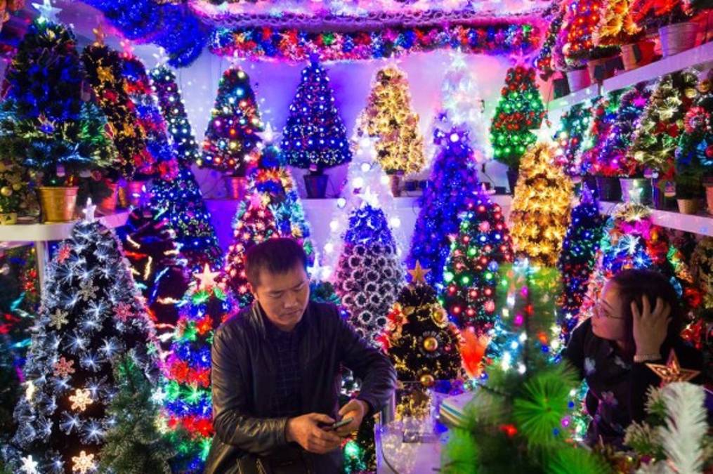 November 27, 2015, Yiwu China - A stall featuring Christmas trees in the Festival Arts section of Arts of Crafts inside the Yiwu International Trade Market. Yiwu International Trade Market is the world's largest whole sale market for small commodities. These plastic trees are made locally at the Sinte An factory.