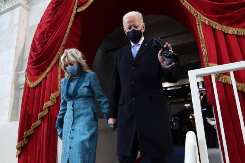 WASHINGTON, DC - JANUARY 20: President-elect Joe Biden and his wife Dr. Jill Biden arrive for his inauguration on the West Front of the U.S. Capitol on January 20, 2021 in Washington, DC. During today's inauguration ceremony Biden becomes the 46th President of the United States. Jonathan Ernst-Pool/Getty Images/AFP