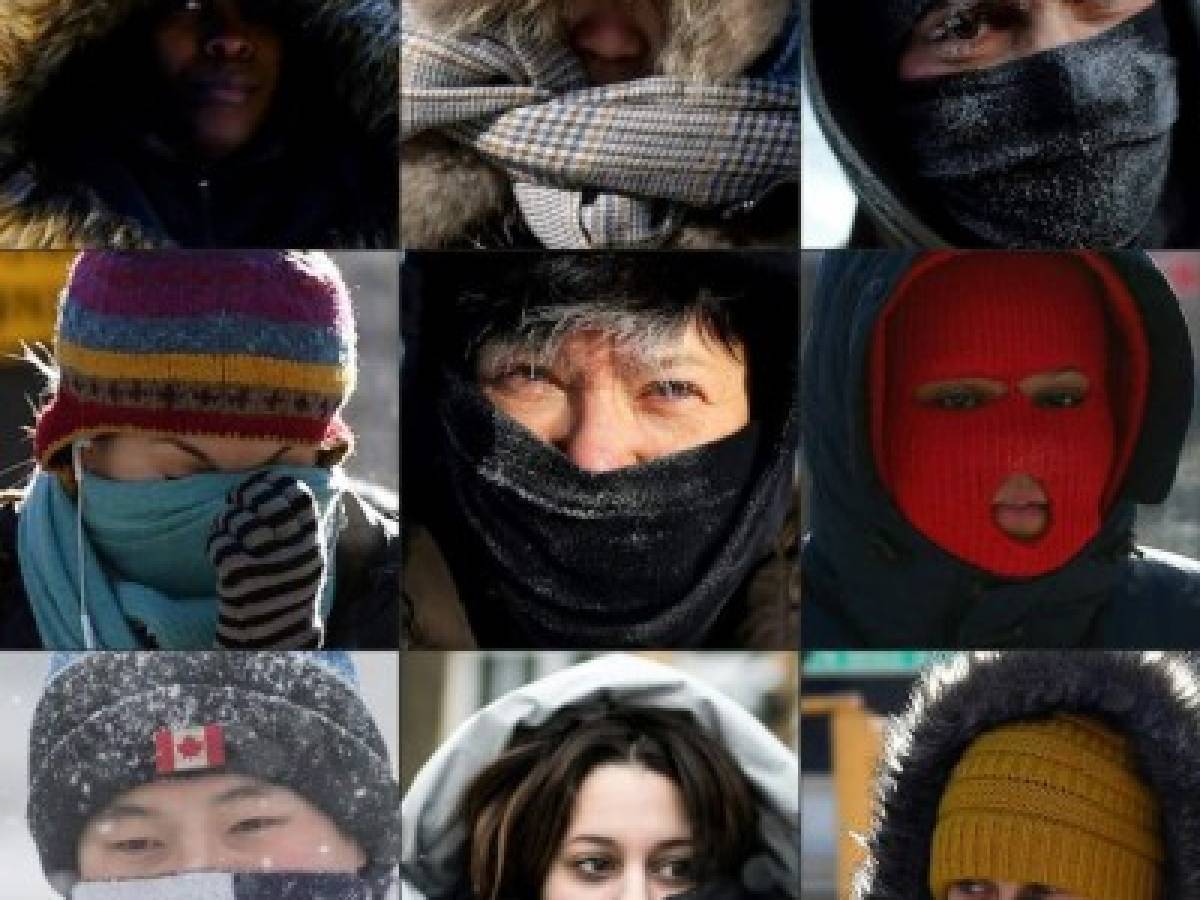 (COMBO) This combination of pictures taken 30 and 31st of January and created on January 31, 2019 shows pedestrians protecting their faces from the cold in New York City, in Washington DC, along Lake Michigan's ice covered shoreline, in the Brooklyn borough of New York, in Chicago, in Kingston, Ontario, and in Montreal. - A brutal cold wave moved eastward after bringing temperatures in Canada and the US Midwest lower than those in Antarctica, grounding flights, closing schools and businesses and raising fears of hypothermia. The extreme weather has now been blamed for as many as eight deaths, US news outlets reported. (Photos by AFP)