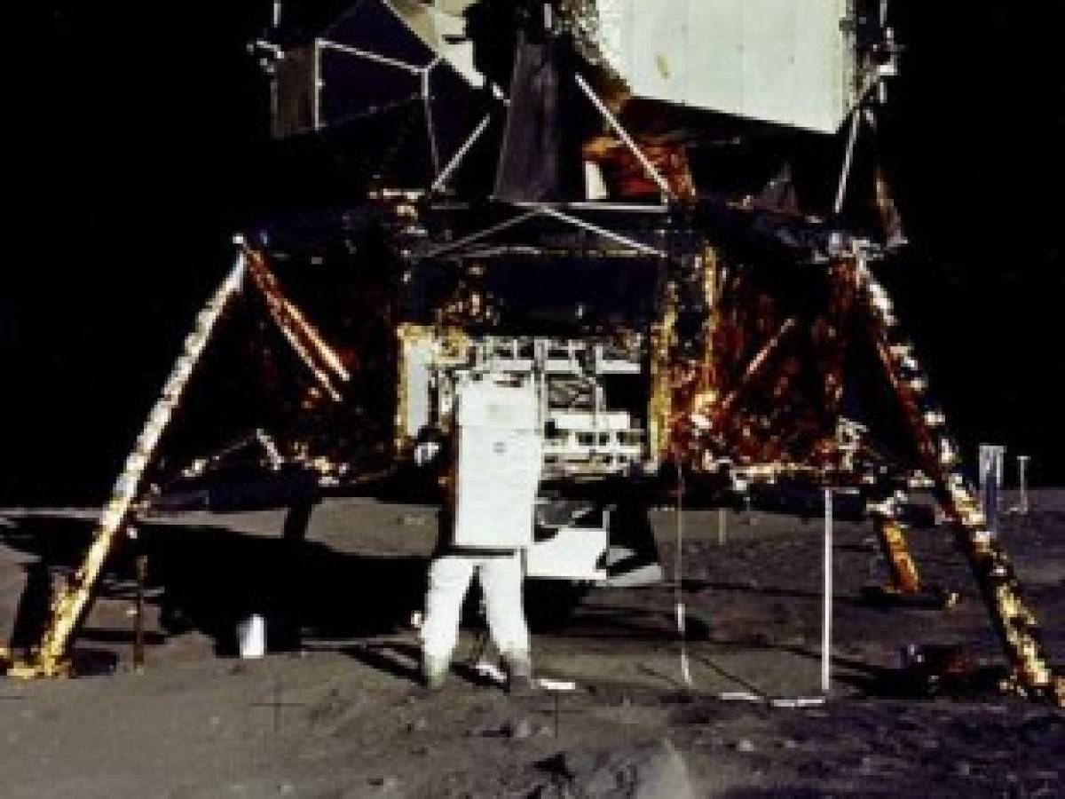 This July 20, 1969, photo taken by Neil Armstrong and obtained from NASA, shows Apollo 11 astronaut Edwin 'Buzz' Aldrin, removing a scientific experiment from the Eagle Lunar Module during the Apollo 11 lunar landing mission. (Photo by Neil ARMSTRONG / NASA / AFP) / RESTRICTED TO EDITORIAL USE - MANDATORY CREDIT 'AFP PHOTO / NASA / Neil Armstrong' - NO MARKETING NO ADVERTISING CAMPAIGNS - DISTRIBUTED AS A SERVICE TO CLIENTS