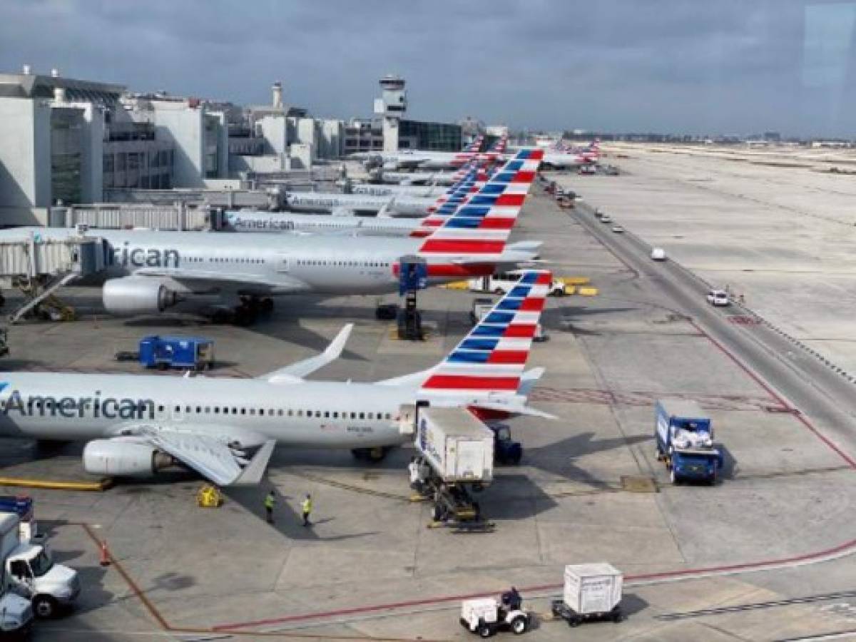 (FILES) In this file photo taken on March 03, 2020 American Airlines planes are seen at Miami International Airport (MIA) in Miami, Florida. - The coronavirus pandemic sent global air passenger demand plunging 14 percent in February, marking the steepest decline in traffic since the September 11 attacks in 2001, the global aviation association said Thursday. 'Airlines were hit by a sledgehammer called COVID-19 in February,' Alexandre de Juniac, head of the International Air Transport Association, said in a statement, pointing out that global numbers had slumped 14.1 percent year-on-year in February, while the drop for carriers in the Asia Pacific region was 41 percent. (Photo by Daniel SLIM / AFP)