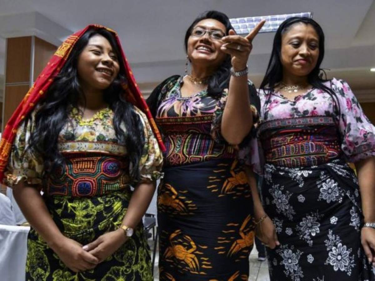 Panama's Guna Yala indigenous women wearing Molas (Guna's hand made textile) attend a press conference in Panama City, on May 21, 2019. - Representatives of natives Guna requested the manufacturer of sportswear and footwear Nike to suspend the launch of a new shoe with a Panamanian Kuna mola print (a hand-made textile) on it, scheduled for next June 6 in Puerto Rico. (Photo by Luis ACOSTA / AFP)