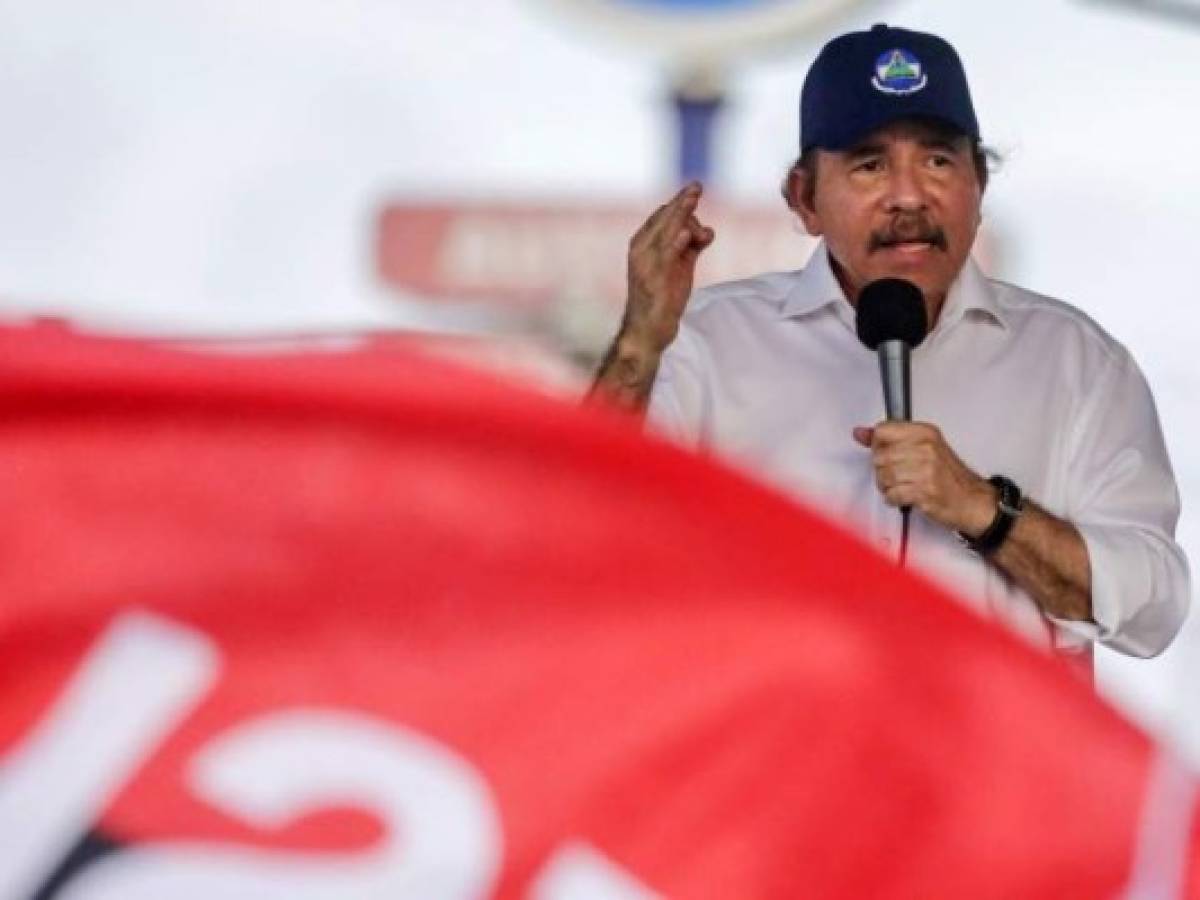 View of a screen broadcasting President Daniel Ortega during the 125th anniversary of the birth of General Augusto C. Sandino in Managua on May 18, 2020. - Nicaragua's government announced the closure of borders with Costa Rica after Costa Rican authorities began to restrict the entry of cargo trucks through its border on Monday to contain the spread of COVID-19. (Photo by INTI OCON / AFP)