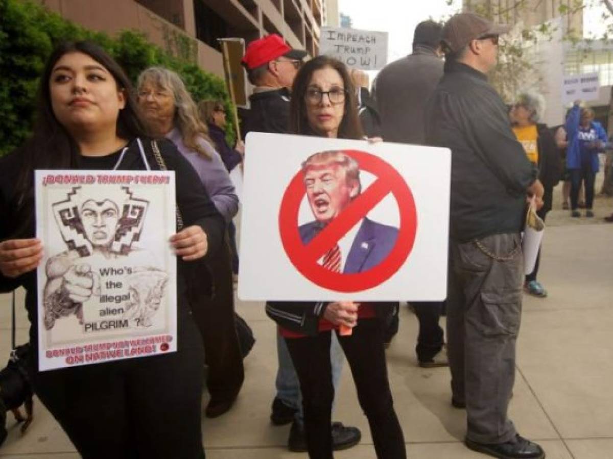 SAN DIEGO, CA-MARCH 12: Anti-Donald Trump demonstrators during a rall on March 12, 2018 in San Diego, California. The rally was held on the eve of President Trump's visit to California where he will be viewing prototypes of a border wall between Mexico and the United States, and then attending a fund-raiser in Beverly Hills. Sandy Huffaker/Getty Images/AFP