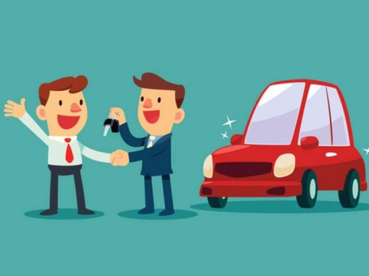 Car salesman give a handshake and new car key to businessman. Car sale. Auto business concept.