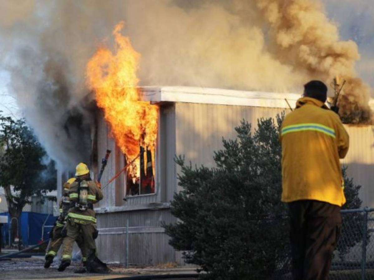 RIDGECREST, CALIFORNIA - JULY 06: Firefighters work to put out a house fire, the morning after a 7.1 magnitude earthquake struck in the area, on July 6, 2019 in Ridgecrest, California. The earthquake, which occurred July 5th, was the second large earthquake to hit the area in two days and the largest in Southern California in 20 years. Mario Tama/Getty Images/AFP