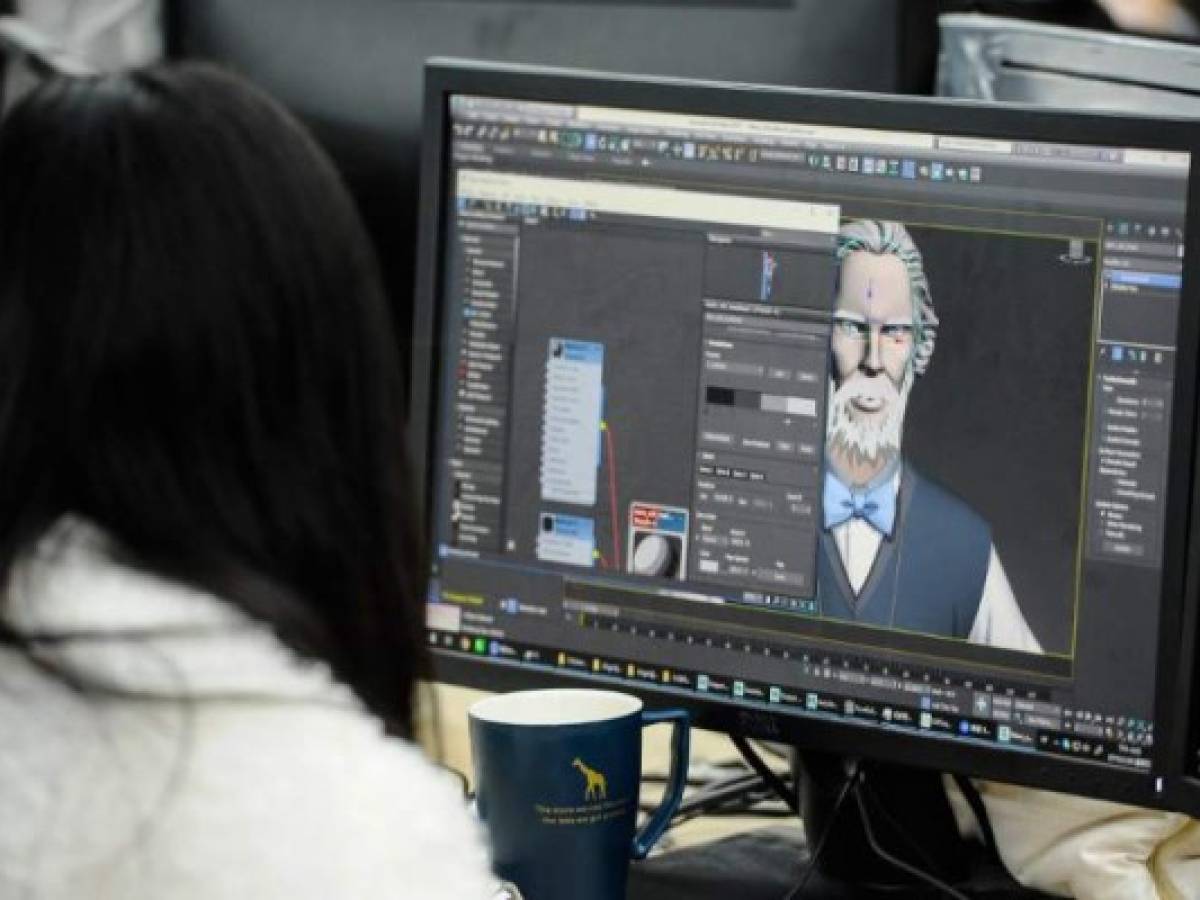 This photo taken on February 28, 2019 shows a staff member working on the online cartoon series 'The Leader' at the Wawayu animation studio in Hangzhou in China's eastern Zhejiang province. - The Chinese Communist Party is trying a new way to woo younger people, commissioning an anime series whose hero is clean-shaven, slim and a hopeless romantic -- Karl Marx. (Photo by STR / AFP) / China OUT / TO GO WITH China-politics-animation-Marx, FEATURE by Eva XIAO