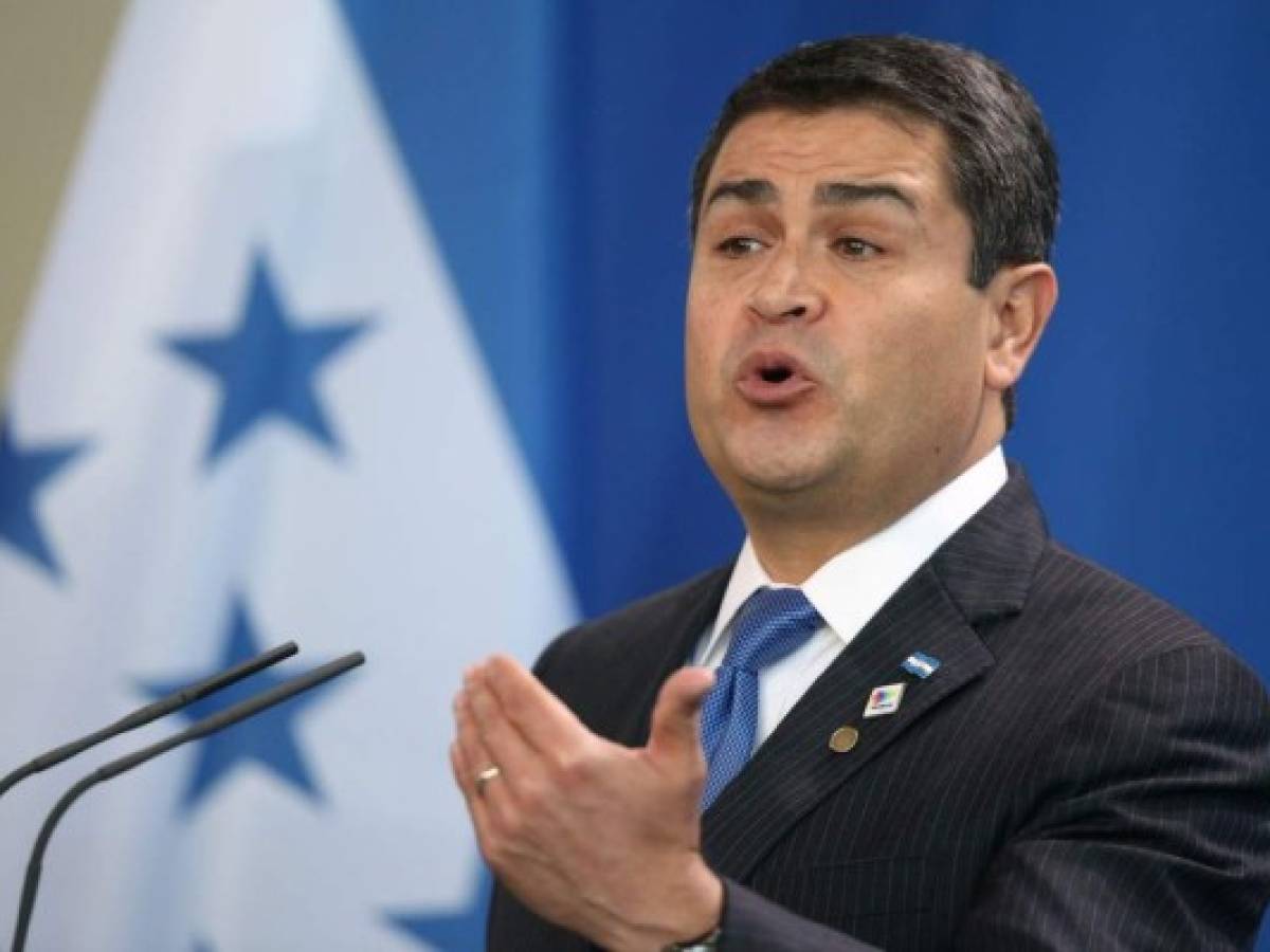Justicia de EEUU acusa a presidente de Honduras de ayudar a traficar cocaína
