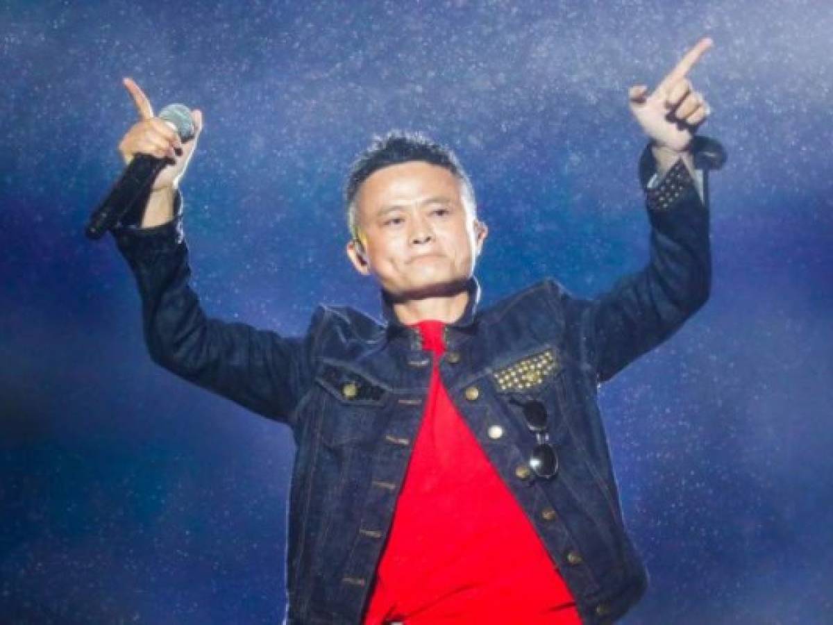 This photo taken on October 11, 2017 shows Jack Ma, Alibaba Group founder and executive chairman, gesturing during the Music Festival of the Computing Conference 2017 in Hangzhou in China's eastern Zhejiang province. / AFP PHOTO / STR / China OUT