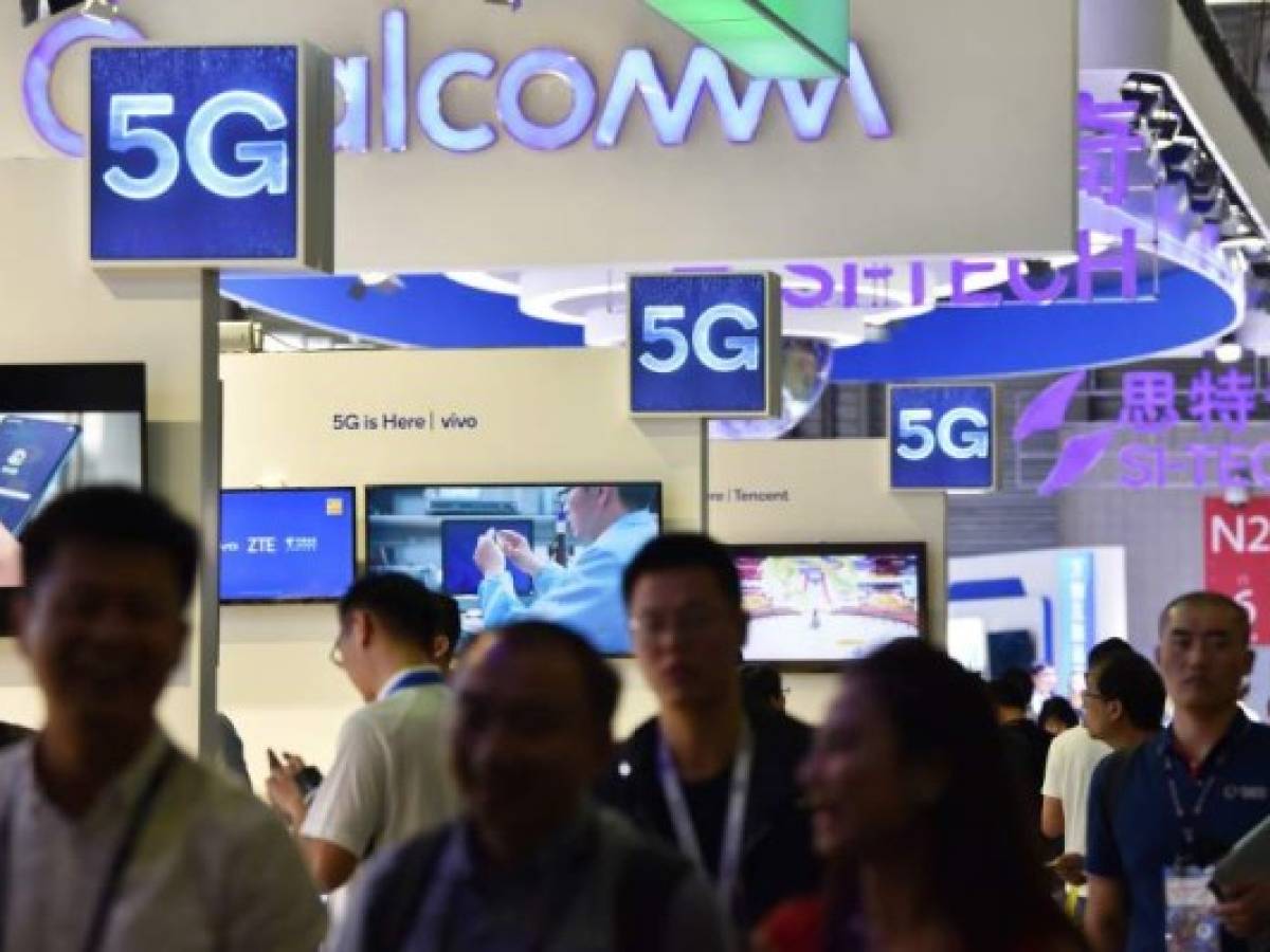 Logos of 5G providers are seen at a stand during the Mobile World Congress (MWC 2019) introducing next-generation technology at the Shanghai New International Expo Centre (SNIEC) in Shanghai on June 27, 2019. (Photo by HECTOR RETAMAL / AFP)