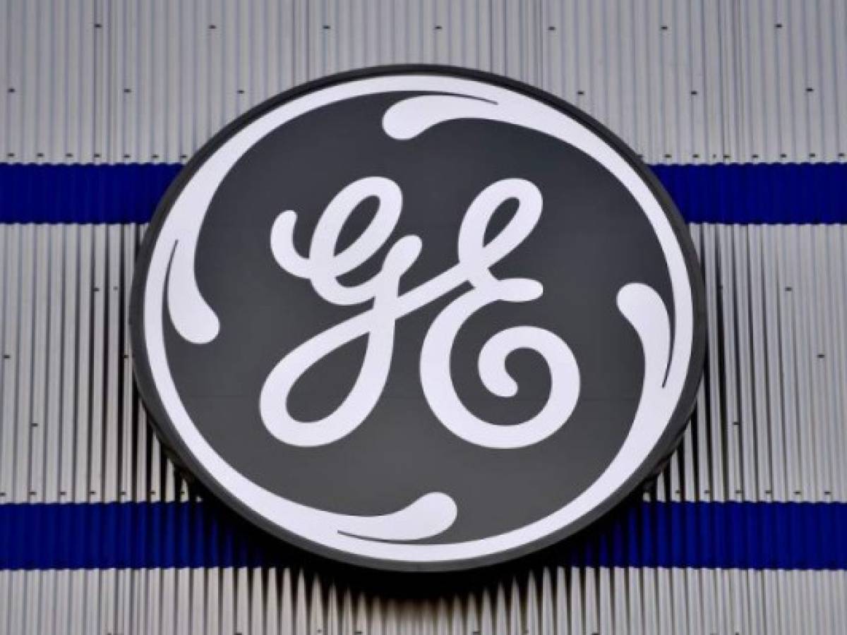 (FILES) In this file photo taken on November 21, 2016 the logo of US company General Electric is seen at a factory of the group, in Montoir-de-Bretagne, western France. Once-dominant industrial giant General Electric announced June 26, 2018 it will shed its healthcare business to concentrate on power and aviation, in the latest attempt to shore up the struggling company. After a year-long strategic review, 'GE will focus on Aviation, Power and Renewable Energy, creating a simpler, stronger, leading high-tech Industrial company,' the company said in a statement. / AFP PHOTO / LOIC VENANCE