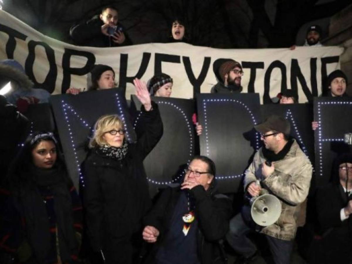 (FILES) In this file photo taken on January 24, 2017 US actress and political activist Jane Fonda (2nd L) attends a rally with opponents of the Keystone XL and Dakota Access pipelines as they protest US President Donald Trump's executive orders advancing their construction, at Columbus Circle in New York on January 24, 2017. - Judge Brian Morris of the US District Court for the District of Montana on November 8, 2018, halted construction of the Keystone XL oil pipeline, arguing that President Donald Trump's administration had failed to adequately explain why it had lifted a ban on the project. (Photo by JASON SZENES / AFP)