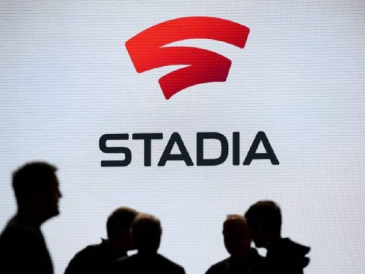 SAN FRANCISCO, CALIFORNIA - MARCH 19: Attendees stand near the Stadia logo during the GDC Game Developers Conference on March 19, 2019 in San Francisco, California. Google announced Stadia, a new streaming service that allows players to play games online without consoles or computers. Justin Sullivan/Getty Images/AFP