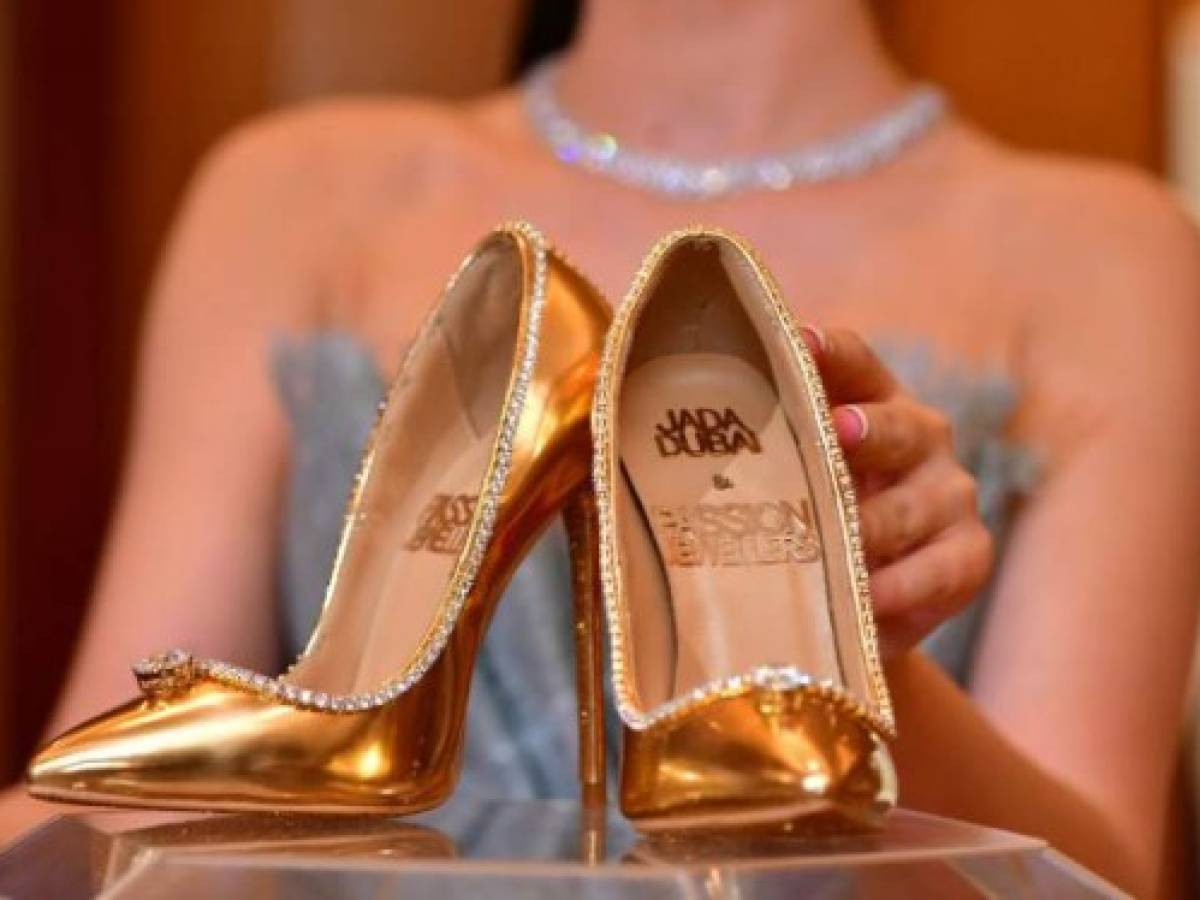 A pair of shoes worth 17 million US dollars are seen on display at Burj Al Arab during the launch presentation in Dubai on September 26, 2018.The Passion Diamond Shoes, features hundreds of diamonds, together with two imposing D-flawless diamonds of 15 carats each. / AFP PHOTO / GIUSEPPE CACACE