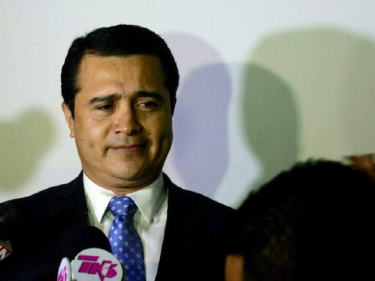The brother of Honduran President Juan Orlando Hernandez and deputy for the ruling Partido Nacional de Honduras, Juan Antonio Hernandez prepares to speak with the press upon arrival at the Toncontin international airport from the United States, on October 25, 2016 in Tegucigalpa. - Earlier this month, Honduran army captain Santos Rodriguez Orellana accused the US Drug Enforcement Administration (DEA) of pressuring him to implicate Hernandez of involvement in a plan to kill the US ambassador, whilst the US is investigating Orellana for alleged corruption and ties to drugs gangs. President Hernandez pledged not to support his brother if it turns out the army captain is involved in drug-related crime as alleged. (Photo by ORLANDO SIERRA / AFP)