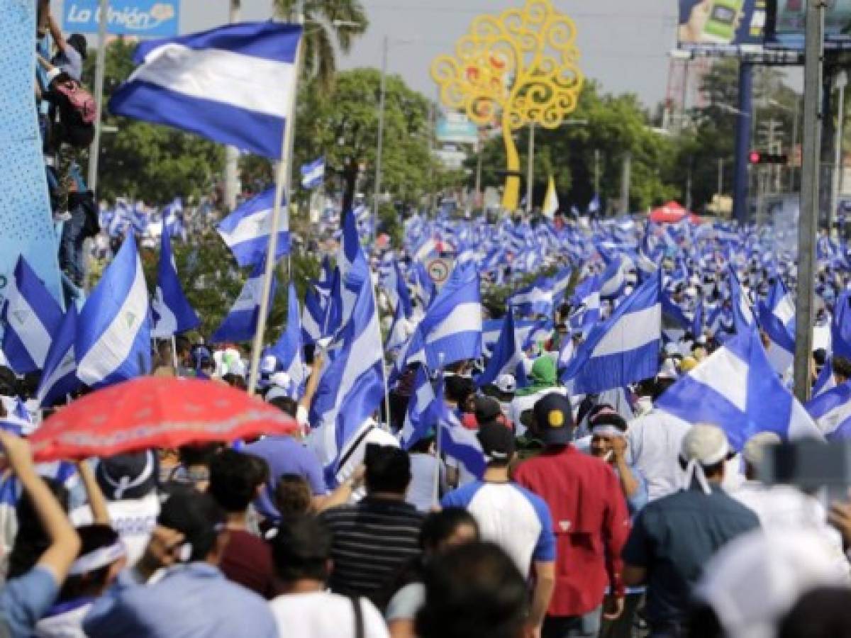 Manifestantes protestan contra el presidente de Nicaragua, Daniel Ortega, en demanda de justicia y democracia este 9 de mayo de 2018. AFP PHOTO / INTI OCON