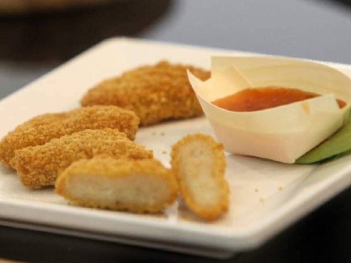 Vegan chicken nuggets are pictured at the international meat industry fair IFFA in Frankfurt am Main, western Germany, on May 6, 2019. - Young butchers gathered in Frankfurt for an international contest are open to updating their trade, but have yet to be won over by 'strange' meat substitutes gaining footholds in the market. (Photo by Daniel ROLAND / AFP)