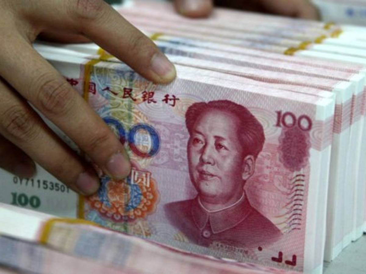 Banco central de China da por concluido el ajuste del yuan tras triple devaluación