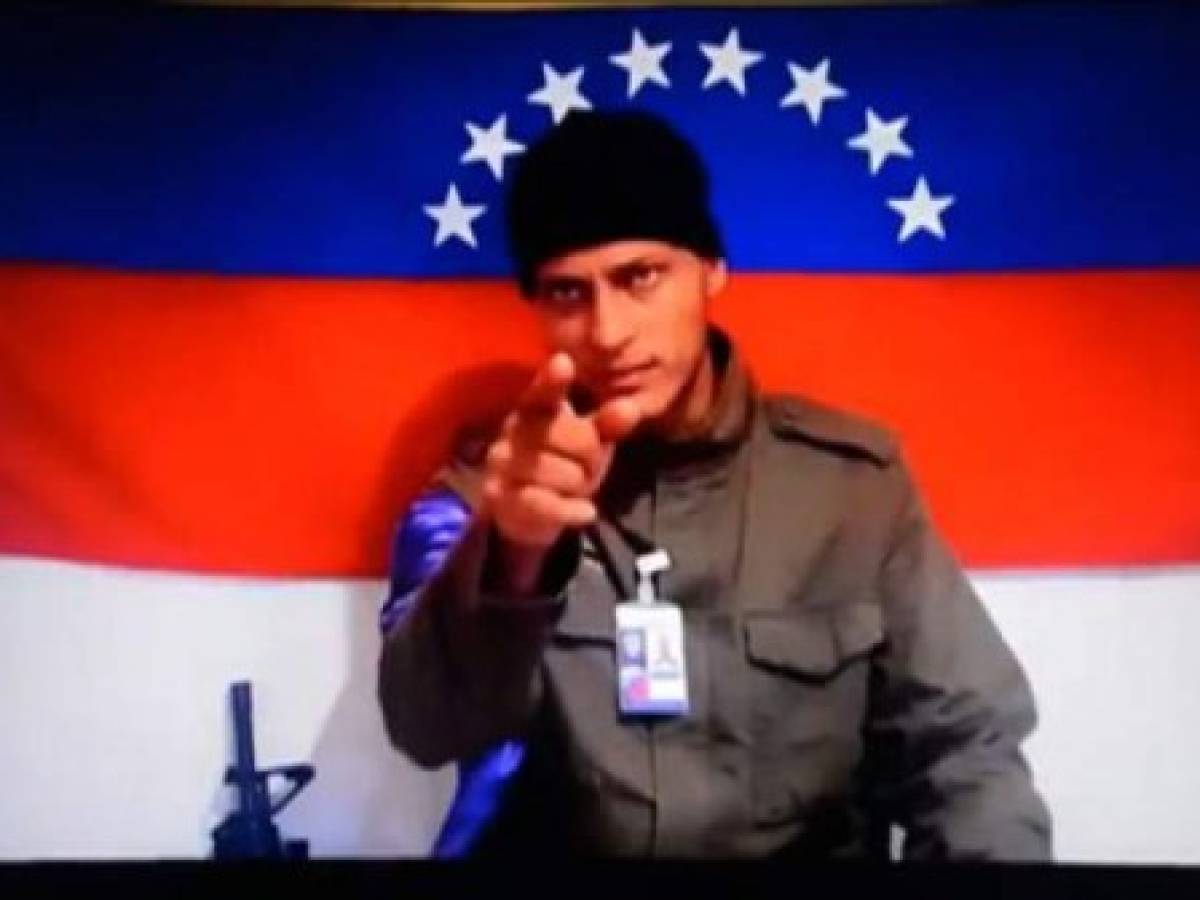Grab picture taken from a handout video released by Anonymous Venezuela late on July 4, 2017 showing the Venezuelan helicopter pilot who vanished after allegedly dropping grenades on the Supreme Court, Oscar Perez, at an undisclosed location, in which he urged Venezuelans to 'stand firm in the streets' in their protests against President Nicolas Maduro.A political and economic crisis in the oil-producing country has spawned often violent demonstrations by protesters demanding Maduro's resignation and new elections. The unrest has left 91 people dead since April 1. / AFP PHOTO / ANONYMOUS VENEZUELA / HO / RESTRICTED TO EDITORIAL USE - MANDATORY CREDIT 'AFP PHOTO / ANONYMOUS VENEZUELA / HO' - NO MARKETING NO ADVERTISING CAMPAIGNS - DISTRIBUTED AS A SERVICE TO CLIENTS