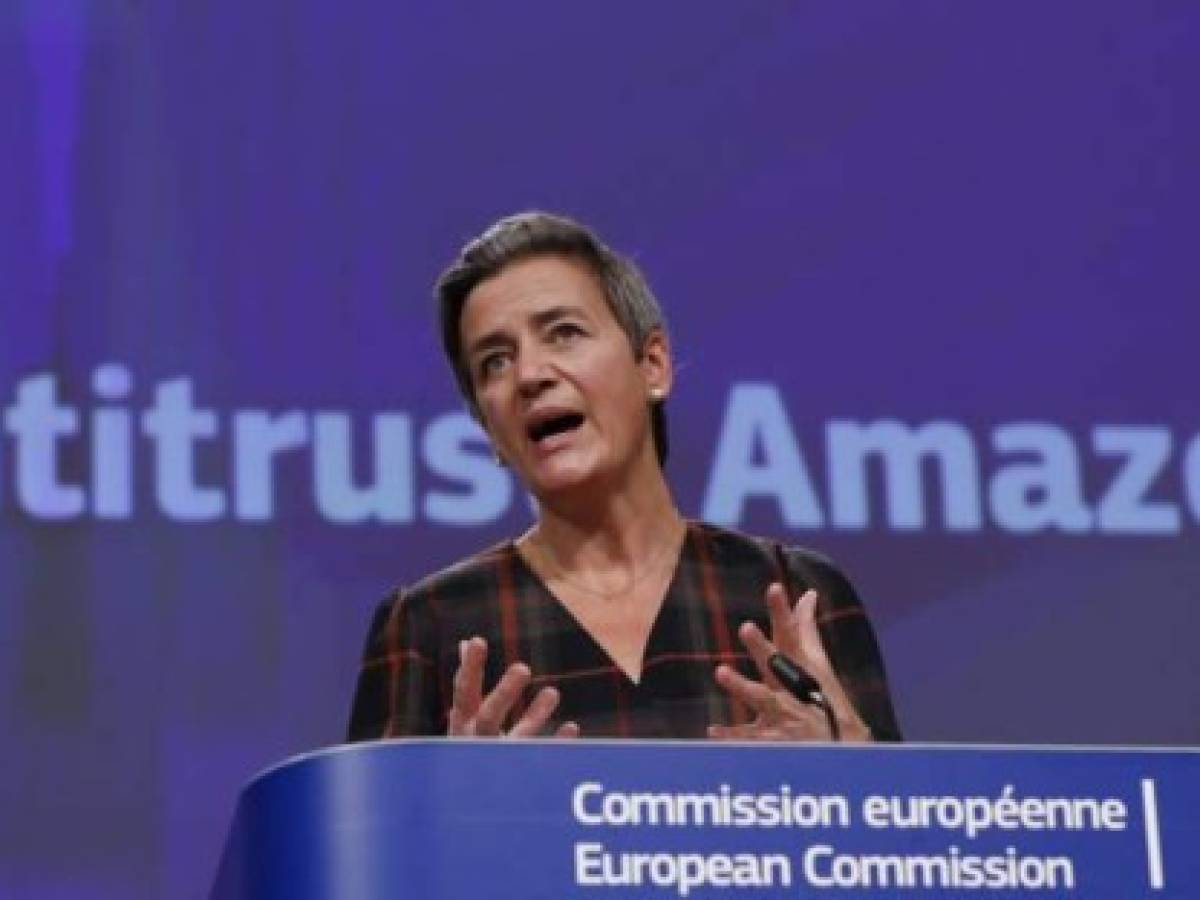 European Executive Vice-President Margrethe Vestager gives a press conference on an anti-trust case with the multinational technology company, Amazon website at European Commission in Brussels on November 10, 2020. - The European Union formally accused US giant Amazon on November 10, 2020, of abusing its control over an online marketplace to distort competition, a breach of anti-trust rules. Competition commissioner Margrethe Vestager said Brussels had informed the company of its view and would push on with an investigation, while opening a second formal probe. (Photo by Olivier HOSLET / POOL / AFP)