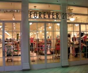 A shopper exits a Forever 21 store at a shopping mall in Montebello, California on September 30, 2019 a day after the fashion retailer filed for Chapter 11 bankruptcy protection. (Photo by Frederic J. BROWN / AFP)