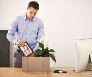 Shot of a young businessman packing his belongings away after being firedhttp://195.154.178.81/DATA/i_collage/pi/shoots/783398.jpg