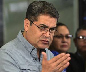 <i>Juan Orlando Hernández, expresidente de Honduras, en un evento durante su último mandato presidencial. FOTO ORLANDO SIERRA / AFP</i>