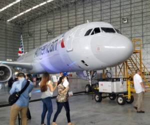 (FILES) In this file photo taken on April 11, 2020, an American Airlines airplane is parked at a gate at Washington National Airport in Arlington, Virginia. - American Airlines will add more flights in July on improving demand, the company said on June 4, 2020, suggesting the industry had seen the worst of the hit from the coronavirus shutdowns. (Photo by Daniel SLIM / AFP)