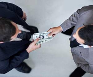 Two businessmen exchanging cash