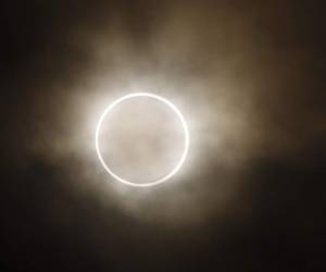 FILE - In this May 21, 2012 file photo, the moon slides across the sun, showing a blazing halo of light, during an annular eclipse at a waterfront park in Yokohama, near Tokyo. The first solar eclipse of the year happens Tuesday, April 29, 2014, and will be visible to skygazers in Antarctica, Australia, and the southern Indian Ocean. The eclipse Tuesday is a rare type of annular eclipse, meaning the sun will appear as a ring around the moon. (AP Photo/Shuji Kajiyama, File)