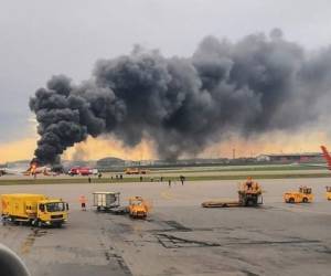 This handout grab of a video obtained from the Instagram account of Gunkevitch on May 5, 2019, shows a fire of a Russian-made Superjet-100 at Sheremetyevo airport outside Moscow. - The Interfax agency reported that the plane, a Russian-made Superjet-100, had just taken off from Sheremetyevo airport on a domestic route when the crew issued a distress signal. 13 person died according to Russian agencies. (Photo by HO / INSTAGRAM / AFP) / RESTRICTED TO EDITORIAL USE - MANDATORY CREDIT 'AFP PHOTO / Gunkevitch' - NO MARKETING NO ADVERTISING CAMPAIGNS - DISTRIBUTED AS A SERVICE TO CLIENTS --- NO ARCHIVE