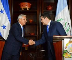 Otto Pérez Molina, presidente de Guatemala, y Orlando Hernández, presidente de Honduras. (Foto: AFP).