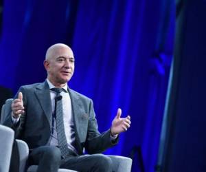 Blue Origin founder Jeff Bezos speaks after receiving the 2019 International Astronautical Federation (IAF) Excellence in Industry Award during the the 70th International Astronautical Congress at the Walter E. Washington Convention Center in Washington, DC on October 22, 2019. (Photo by MANDEL NGAN / AFP)