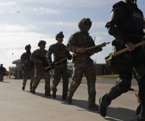 HIDALGO, TX - NOVEMBER 05: U.S. Customs and Border Protection (CBP) agents take part in a training exercise at the U.S.-Mexico border on November 5, 2018 in Hidalgo, Texas. Days before, U.S. Army soldiers put up razor wire at the same port of entry as part of 'Operation Faithful Patriot.' President Donald Trump ordered troops to the border ahead of midterm elections and weeks before the possible arrival of a migrant caravan. John Moore/Getty Images/AFP