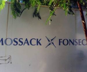 View of a sign outside the building where Panama-based Mossack Fonseca law firm offices are placed in Panama City on April 3, 2016. A massive leak -coming from Mossack Fonseca- of 11.5 million tax documents on Sunday exposed the secret offshore dealings of aides to Russian president Vladimir Putin, world leaders and celebrities including Barcelona forward Lionel Messi. An investigation into the documents by more than 100 media groups, described as one of the largest such probes in history, revealed the hidden offshore dealings in the assets of around 140 political figures -- including 12 current or former heads of states. AFP PHOTO / RODRIGO ARANGUA / AFP / RODRIGO ARANGUA