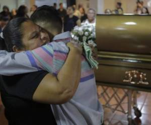Yadira Cordoba (L), mother of 14-year-old Orlando Cordoba, allegedly killed by the police during a mother's day protest against Nicaraguan President Daniel Ortega, embraces a relative during her son's wake in Managua on June 1, 2018.The death toll from weeks of violent unrest in Nicaragua rose to 100 on Thursday as embattled President Ortega rejected calls to step down and the Catholic Church, which has tried to mediate the conflict, refused to resume the dialogue. / AFP PHOTO / Inti OCON
