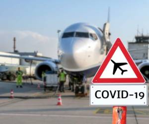 Airplane at the airport warning sign coronavirus