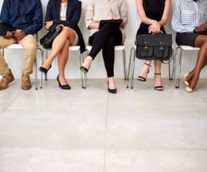 Shot of a group of businesspeople seated in line while waiting to be interviewed