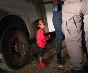 MCALLEN, TX - JUNE 12: A two-year-old Honduran asylum seeker cries as her mother is searched and detained near the U.S.-Mexico border on June 12, 2018 in McAllen, Texas. The asylum seekers had rafted across the Rio Grande from Mexico and were detained by U.S. Border Patrol agents before being sent to a processing center for possible separation. Customs and Border Protection (CBP) is executing the Trump administration's 'zero tolerance' policy towards undocumented immigrants. U.S. Attorney General Jeff Sessions also said that domestic and gang violence in immigrants' country of origin would no longer qualify them for political asylum status. John Moore/Getty Images/AFP