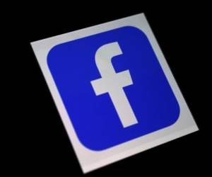 (FILES) In this file illustration photo taken on March 25, 2020 a Facebook App logo is displayed on a smartphone in Arlington, Virginia. - Facebook on November 5 shut down a pro-Trump group organizing protests against vote-counting, saying it was being used to delegitimize the election process and included 'worrying' calls for violence. (Photo by Olivier DOULIERY / AFP)