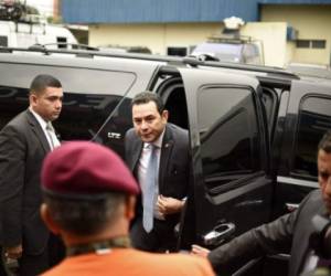 Guatemalan President Jimmy Morales and Vice-President Jafeth Cabrera (C) arrives at the headquarters of Guatemala's National Coordinator for Disaster Reduction (CONRED) in Guatemala City to offer a press conference after a strong earthquake hit the country on June 14, 2017.A strong 6.9 magnitude earthquake hit western Guatemala early on Wednesday, killing at least two people and causing power outages, as well as damage to some buildings, officials said. The epicenter of the quake was about 156 km west of Guatemala City in the department of San Marcos, and was felt across most of the country, including the capital, as well as in neighboring Mexico. / AFP PHOTO / Johan ORDONEZ