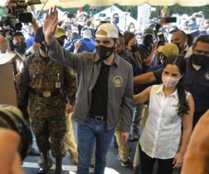 Nayib Bukele, El Salvador&#39;s president, and First Lady Gabriela Bukele depart after casting a ballot at a polling station during legislative elections in San Salvador, El Salvador, on Sunday, Feb. 28, 2021. Bukele is seeking to expand his power in Congress with voters heading to the polls Sunday in a legislative election that could also pave the way for an International Monetary Fund program.