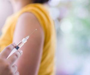 Closeup of doctor hand are vaccinations to patients using the syringe.Medical concept