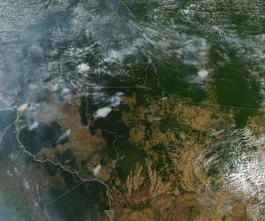 This handout picture collected by a satellite of © 2019 Planet Labs, Inc on August 20, 2019 shows smoke and fires in Brazil's state Mato Grosso. - This week saw an outpouring of social media posts decrying forest fires in the Amazon rainforest, many of them under the hashtag #PrayforAmazonas. But some of the most viral posts are misleading, including either photographs of the Amazon that are years old or images taken in other parts of the world. (Photo by Handout / © 2019 Planet Labs, Inc / AFP) / RESTRICTED TO EDITORIAL USE - MANDATORY CREDIT 'AFP PHOTO / © 2019 Planet Labs, Inc ' - NO MARKETING - NO ADVERTISING CAMPAIGNS - DISTRIBUTED AS A SERVICE TO CLIENTS