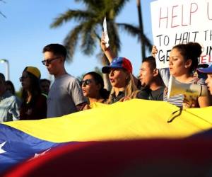 MIAMI, FL - MAY 08: Venezuelan's protest against the Venezuelan government as Florida Governor Rick Scott hosts a Venezuelan Freedom Rally at El Arepazo 2 to show his support for the release of Venezuelan prisoner Leopoldo Lopez on May 8, 2017 in Miami, Florida. Lopez was jailed after he was found guilty in 2014 for inciting violence during protests against Venezuela's President Nicolas Maduro. (Photo by Joe Raedle/Getty Images)