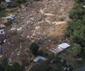 Aerial view of a mudslide where it is estimated that dozens of people died last Thursday, caused by the passage of Hurricane Eta, in the village of Queja, in San Cristobal Verapaz, Guatemala on November 7, 2020. - About 150 people have died or remain unaccounted for in Guatemala due to mudslides caused by powerful storm Eta, which devastated an indigenous village in the country's north, President Alejandro Giammattei said Friday. (Photo by Esteban BIBA / POOL / AFP)