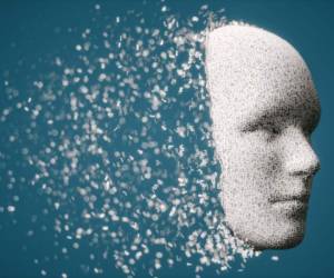 Abstract 3d human face with disintegrating hexadecimal particles.