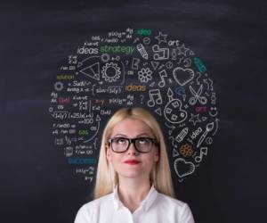 Business woman brain hemisphere on the blackboard